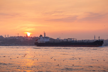 LPG natural gas big size tanker ship passing from Istanbul Bosporus during sunset