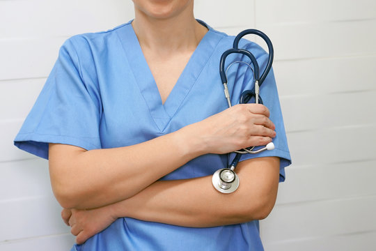 Young nurse with stethoscope. Woman doctor with stethoscope. Image of a trainee doctor.