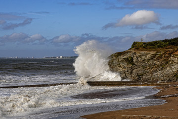 Waves crashing on rocks