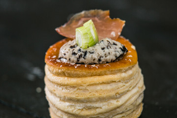 Detail of a canapes of a meal at an event, wedding, meeting or congress with food. Canapes decorated on the dish