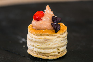 Detail of a canapes of a meal at an event, wedding, meeting or congress with food. Canapes decorated on the dish