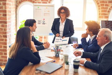 Group of business workers working together in a meeting. Listening one of them speaking at the office.
