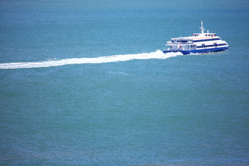 Fototapeta na wymiar modern passenger boat speeding on the sea
