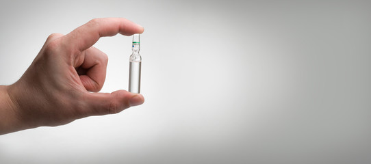 ampoule in a hand