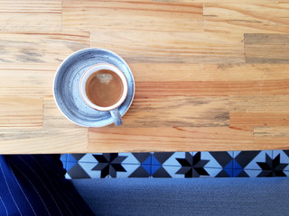 Coffee cup on the wood table. Hot coffee. Morning.