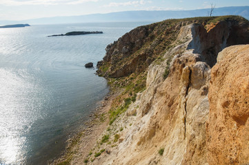 long the coast of beatifull lake and calm blue water