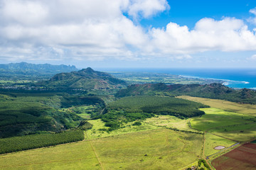 Aerial view of Kauai's lush colorful interior landscape.  The east coast can be seen in background.
