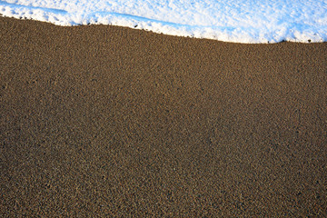 White Waves Atop Sand Texture