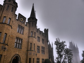 Fototapeta premium Mystic castle in the fog which looks like Hogwarts