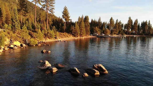 Lake Tahoe slow motion water waves and a boat dock in a bay