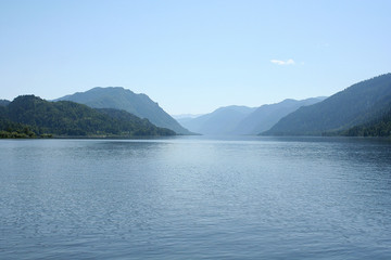 Teletskoye lake in summer in Sunny weather in the mountains covered with green forest