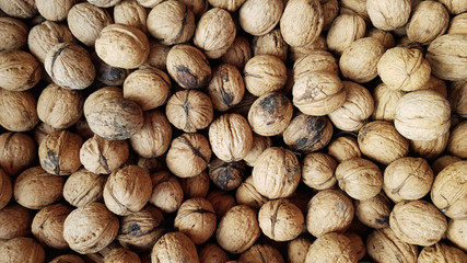 whole walnuts as background