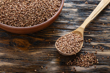 raw buckwheat on a wooden background