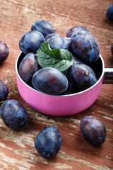 ripe plums in a saucepan