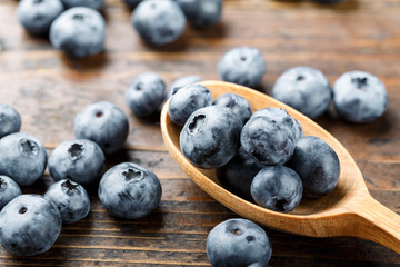 ripe blueberries in a spoon