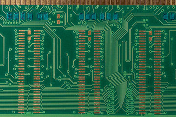 green microcircuit of old computer random access memory from top side, top view, macro photo