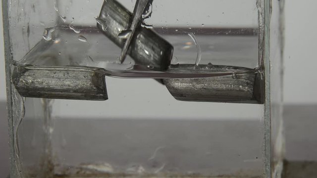 This clip illustrates that solid metallic Lithium can float on oil because of its low mass density. There are no air inclusions in the metal.