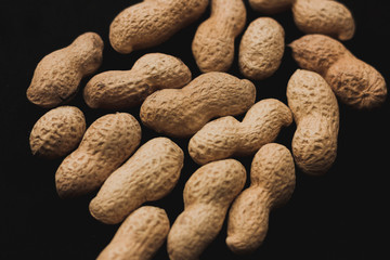 Macro peanuts on black background