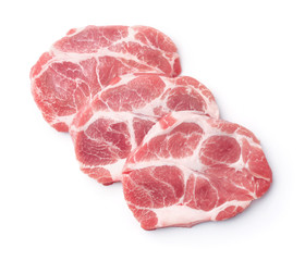 Top view of three raw fresh pork neck meat steaks