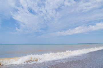 The sea shore at summer Sunny clear day in early summer