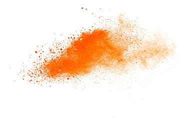 Abstract orange powder explosion. Closeup of orange dust particle splash isolated on white background. - obrazy, fototapety, plakaty