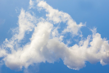 Bright blue sky with white clouds. Background.