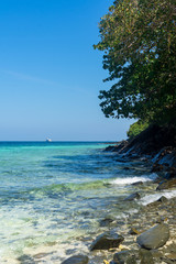 Holidays on the Similan Islands. Exotic vibrant nature, turquoise water and the bright sun in Thailand.