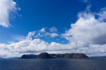 Fototapeta na wymiar Coastline of the island Mageroya (Magerøya) in Norway, Europe in the Barents Sea. Mageroya belongs to the Nordkapp municipality and is the island where the North Cape is located.