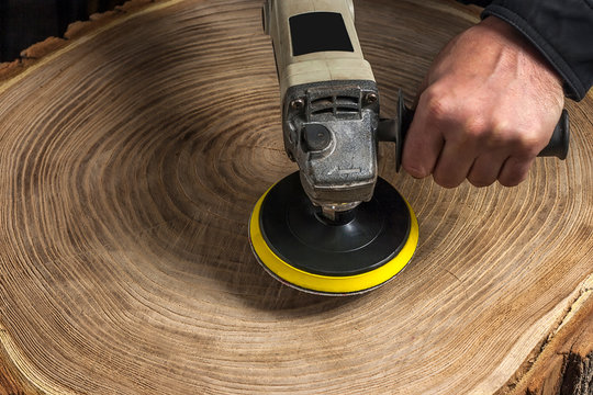 Brushing wood with an electric rotary brush grinder. Do-it-yourself wood aging. Woodworking
