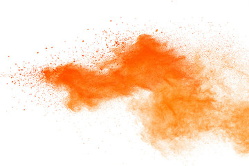 Fototapeta na wymiar Abstract orange powder explosion. Closeup of orange dust particle splash isolated on white background.