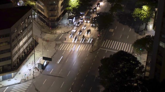 Nighttime motion time lapse of downtown Minas Gerais state capital Belo Horizonte in Brazil with light streaks of long exposure traffic light moving along the avenue revealing the central bus terminal