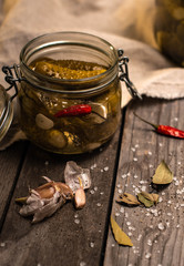pickled cucumbers, cucumbers in a glass jar, canned cucumbers