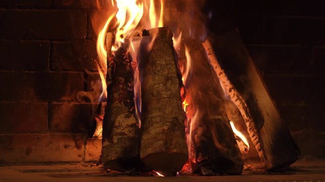Background concept of fireplace chimney with a beautiful dancing fire flame - 4K Professional panning motion of stabilized footage - Eastern Europe Latvia Riga