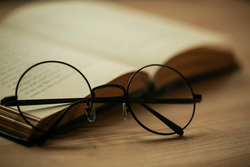 round glasses on a book