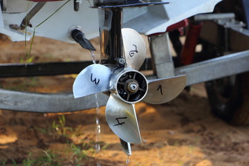 4 blades stainless steel racing outboard motor boat propeller on speedboat transom