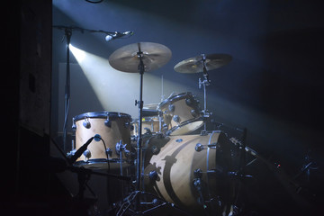 Fototapeta na wymiar Drumset on a stage with one lightsource
