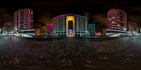 full seamless spherical hdri night panorama 360 near arch between multistory buildings of residential quarter with neon light in windows in equirectangular projection