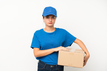 Young delivery girl over isolated white background thinking an idea