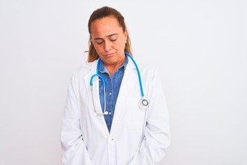 Fototapeta premium Middle age mature doctor woman wearing stethoscope over isolated background depressed and worry for distress, crying angry and afraid. Sad expression.