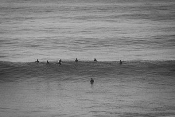 Group of surfers in a surf spot in Ericeira Portugal