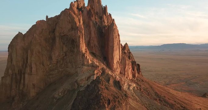 4k aerial flight towards huge rock formation in New Mexico