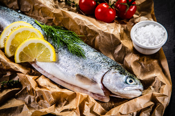 Fresh raw trout and vegetables