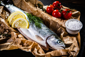 Fresh raw trout and vegetables