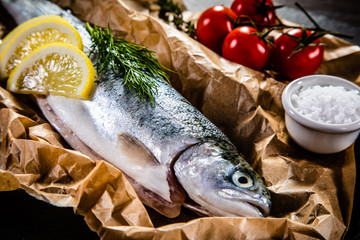 Fresh raw trout and vegetables