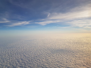 Fototapeta na wymiar Cotton clouds from a plane
