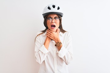 Beautiful businesswoman wearing glasses and bike helmet over isolated white background shouting and suffocate because painful strangle. Health problem. Asphyxiate and suicide concept.