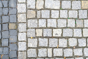 Texture of old Cobbled Pavement close-up. Abstract Stone Background..
