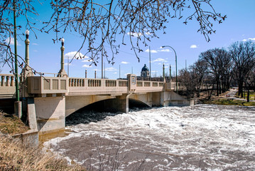 Spring flood of Wascana creek under  the Albert Memorial Bridge (Regina, Saskatchewan)