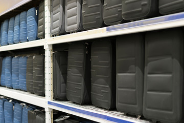 Black suitcases on a shelf in a store. Travel concept