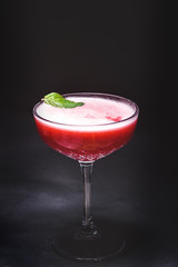 red cocktail with strawberry